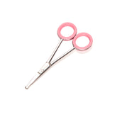 Pair of scissors with pink handles on a white background
